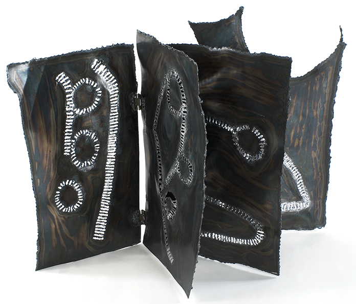 Ideogram Book 2, 24 inches x 36 inches x 24 inches, steel, 2007 ||| Ideograms are a symbolic writing system. The ideograms here are used by the Dogon people of Mali as part of ceremonies and divination. 