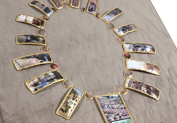Wealth in Africa, 32 inches x 38 inches x 4 inches, mixed media, video & sound, 2013; Multiple Exposures, Museum of Arts & Design, NYC, 2014 ||| Wealth in Africa is a mixed media sculpture in the form of a large necklace. Wealth in Africa highlights the richness of Africa– the people and their culture(s). 